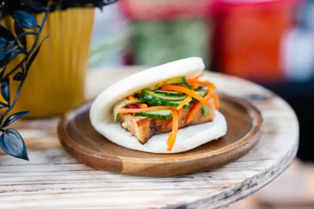 Steamed bun filled with pork, cucumber, and carrot.