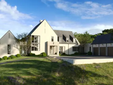 White and gray modern house with a driveway and landscaping.