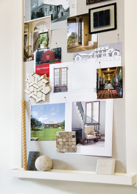 Mood board with architectural photos, fabric samples, and tile samples pinned to a linen-covered board.
