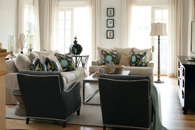 Natural light floods every inch of the family room, where graphite-gray linen chairs anchor the airy space. Practical touches include sofas made of a durable linen blend, which can be taken off and cleaned of spills or smudges by Mayersâ