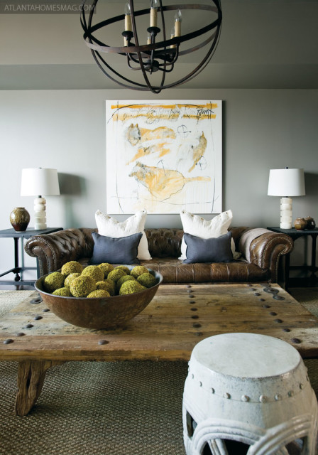 For the living room mantel in Madison, Stanton selected a circa-1880 oil portrait“coincidentally, from the same era as the home“s first addition. In Atlanta, a Helen Durant painting over the roomy leather club sofa, part of the artist“s new wolf series, adds whimsy to the living space.