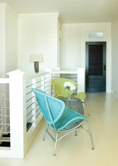 On the second-floor landing, a pair of practically indestructible chairs provides a place for children to hang out.