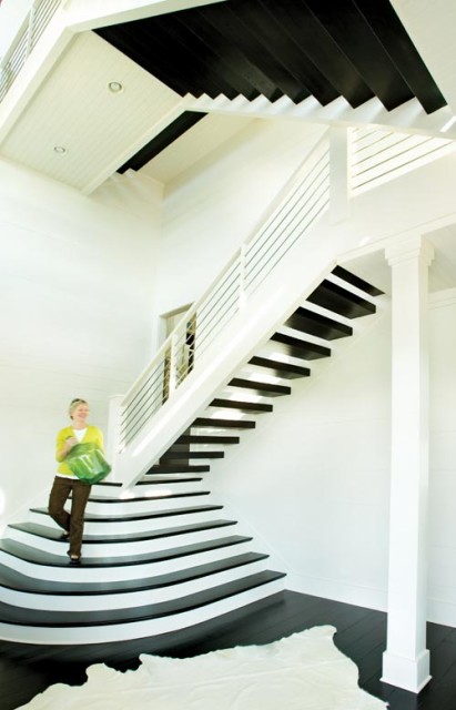 A grand staircase in the foyer lets guests know to expect the unexpected.