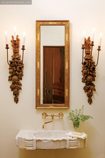 The homeowner found this hundreds-of-years-old sink in Italy and had it cantilevered out of the wall.