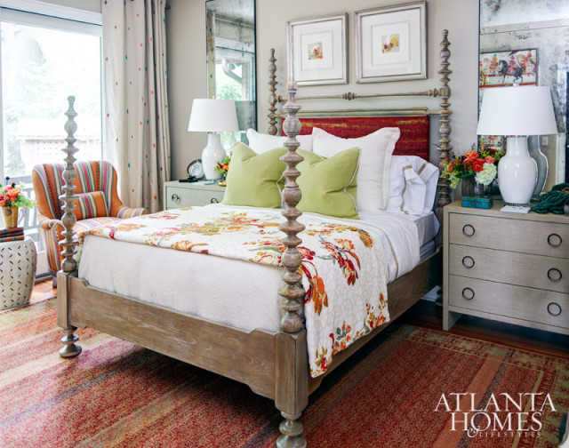 The new No. 9 Collection from Jim Thompson fabrics, with its vibrant color and patterns, inspired Barbara Heath's design for a bedroom in the guest house. Heath sought to convey to showhouse visitors how sumptuous textiles can be integrated into everyday spaces. The main fabric, "Wedding Parade," was framed to look like a piece of tapestry and provided a backdrop for the bedroom. The bed's turned posts and aged look from its cerused finish (sourced from Heath's Atlanta boutique, The Mercantile), played off the exotic nature of the fabrics. Color-blocked framed images also brought a fun fashion trend into a bedroom designed to welcome weary travelers.