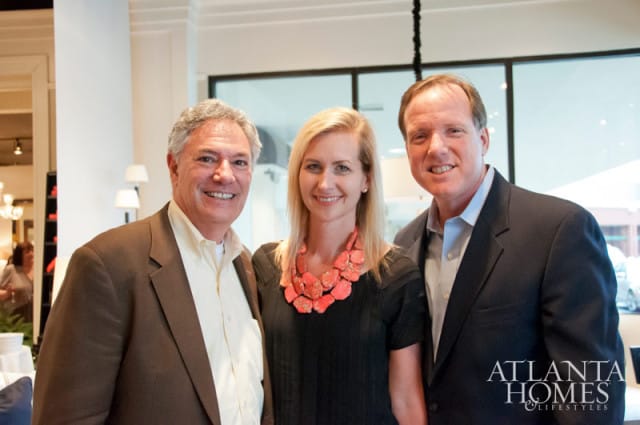 Three people smiling for a photo, with the Atlanta Homes & Lifestyles logo in the lower right corner.