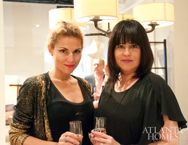 Two women holding champagne flutes, with the Atlanta Homes & Lifestyles logo in the lower right corner.