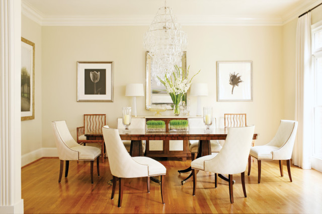 The dining room of Tom and Karen Chapman’s Buckhead townhouse is a testament to decorator Phoebe Howard’s love of symmetry. She designed it around Karen’s existing artwork and dining table, which the decorator describes as a “contemporary twist on a double-pedestal table.”