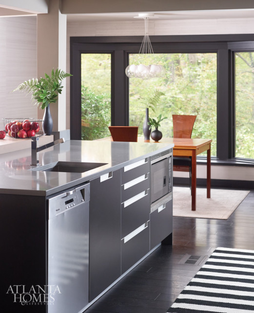 “We customized our Poggenpohl collection cabinetry to suit the client’s request for bold appliances and dark colors.” –John Coulter