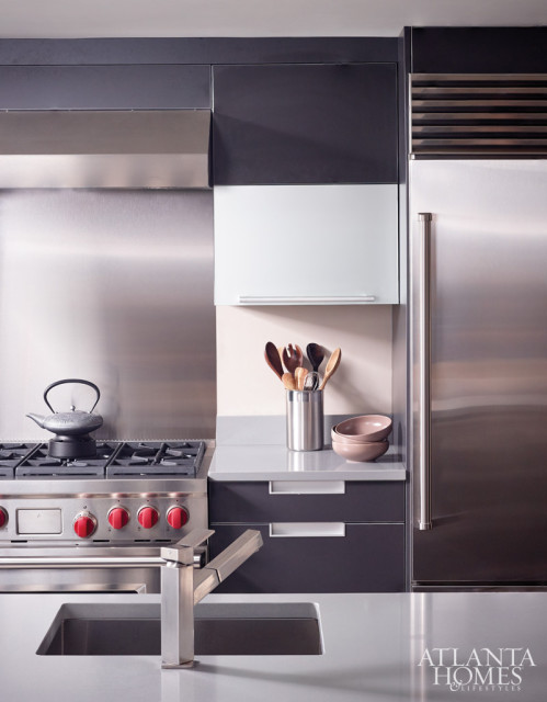 “We customized our Poggenpohl collection cabinetry to suit the client’s request for bold appliances and dark colors.” –John Coulter