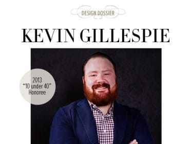 Kevin Gillespie, 2013 "10 under 40" Honoree, wearing a navy blazer over a checkered shirt, with arms crossed.