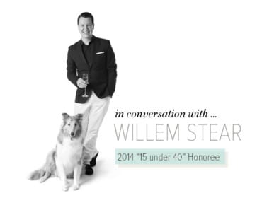 Willem Stear, a man in a dark suit and white pants holding a champagne flute, poses with a collie dog. Text reads "in conversation with... WILLEM STEAR 2014 '15 under 40' Honoree."