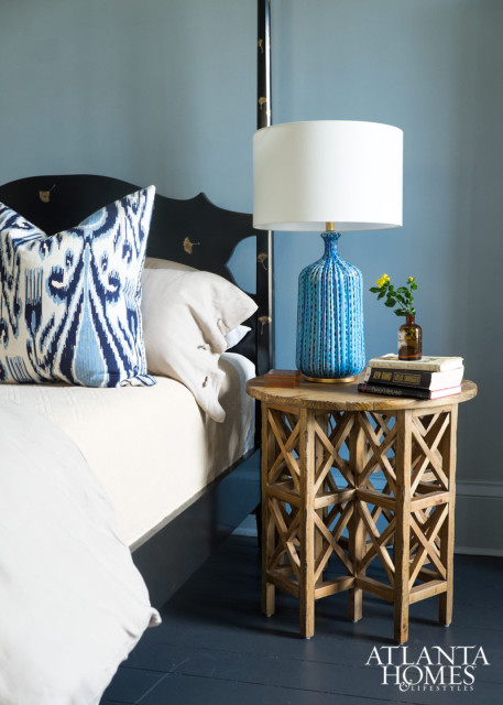The blue bedside lamp is by Aerin.