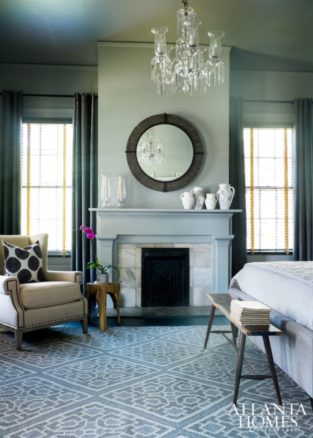 Honeymoon’s four bedrooms illustrate Stanton’s fuss-free approach to decorating; the home’s largest guest room boasts a crystal chandelier that once presided over the dining room. Mod leather chairs surround a fireplace in the master.