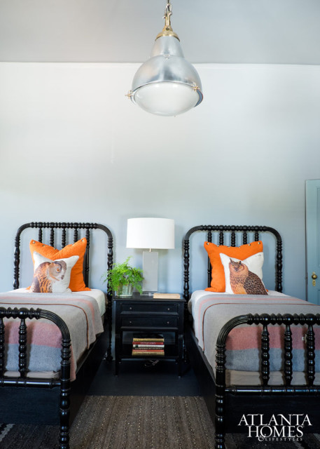 The owl toss pillows on the twin beds are Thomas Paul.