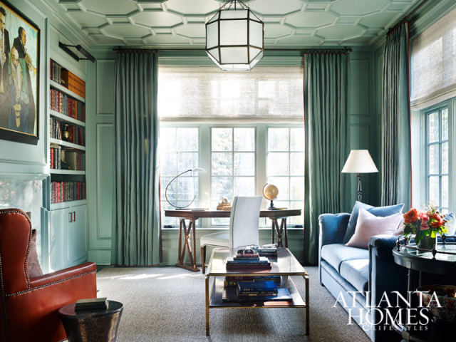 Tone-on-tone elements give the study a classic look. Millner paired a luxe Kneedler Fauchère fabric with a Conrad shade to dress up the windows. The coffee table, desk and seating are from Hickory Chair.