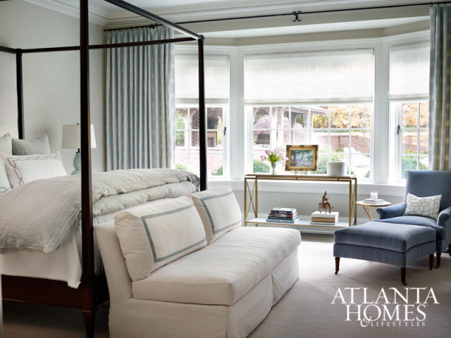 A soft color palette in the master bedroom makes for a quiet and cozy sanctuary. Chair and sofa, Hickory Chair. Bedding, Leontine Linens.