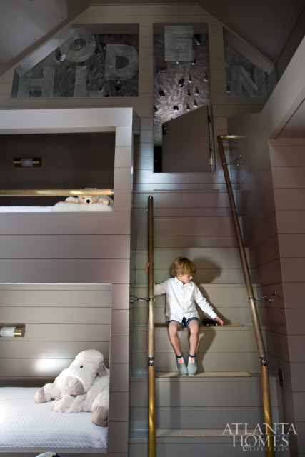 Bold punches of orange filter through Holden’s bathroom and bedroom, where unused space above his built-in bunk beds was transformed into a rock-climbing room Lee admits is fun for all ages.