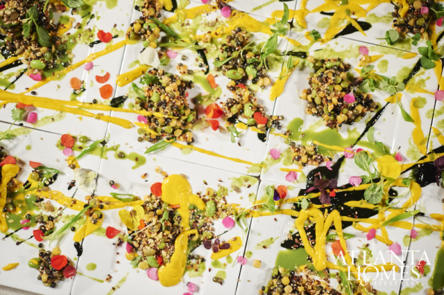 Chef Tyler Williams’s first course was an ode to Pollock with a smattering of seeds, grains, lentils, ink and edible flowers.