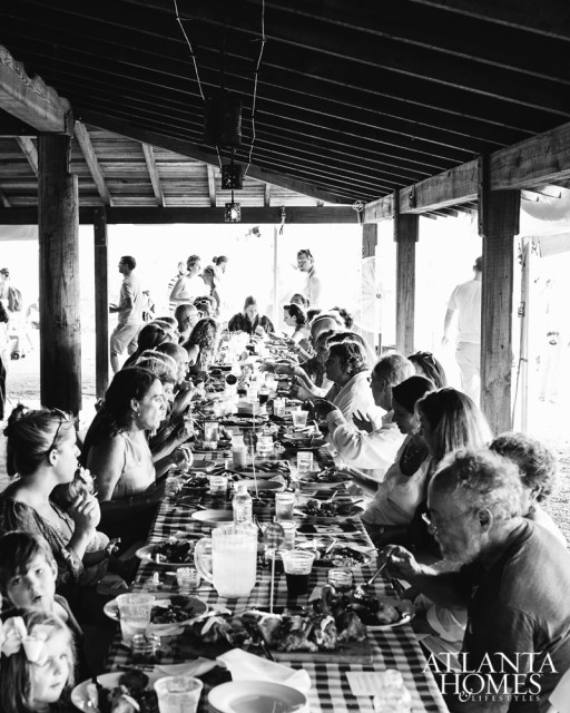Wholesome Wave guests gathered at communal tables to enjoy good company and immaculately prepared food from top local chefs like Asha Gomez.