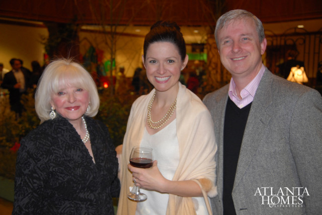 Three people smiling at the camera, with the Atlanta Homes & Lifestyles logo in the bottom right corner.