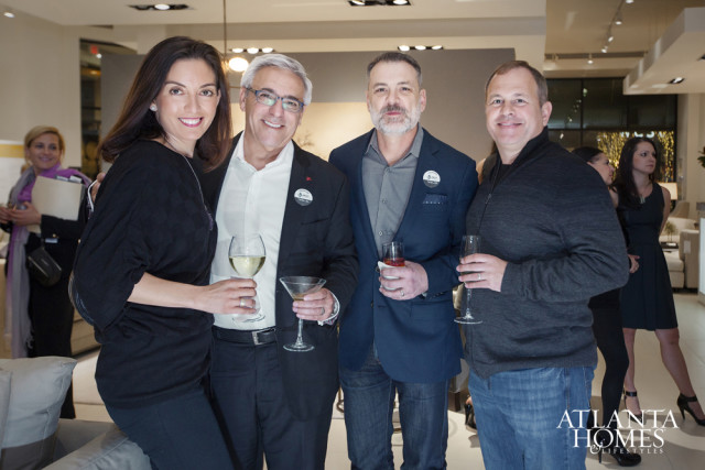 Four people smiling and holding drinks at an event. The Atlanta Homes & Lifestyles logo is visible in the lower right corner.