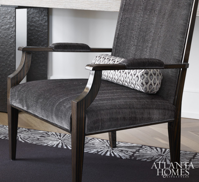 Armchairs by Artistic Frame maintain the home’s subdued color palette of white, gray and blue.