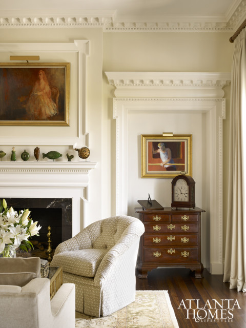 Architectural moldings and niches provide fitting vignettes for the homeowners’ collection of antiques and decorative arts.