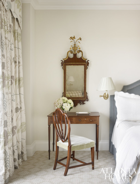 An embroidered botanical by Cowtan & Tout flows from the draperies in the master bedroom.