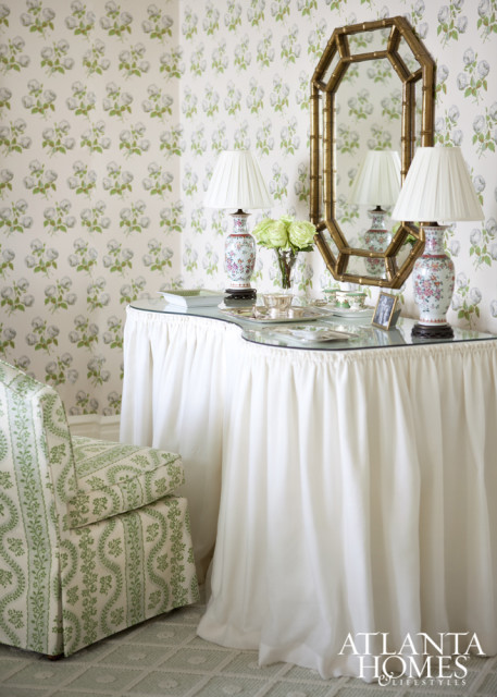 The iconic Sister Parish left her mark on this stylish apartment when Kirkland incorporated her fabrics into the master bedroom on both the tufted armchair and dressing table chair.