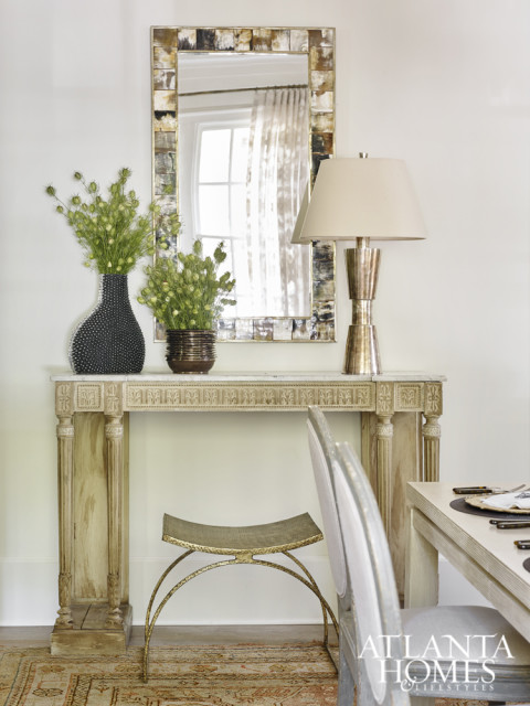 A French console, graphic horn mirror and gilded iron stool also bring the designer’s signature style to life.