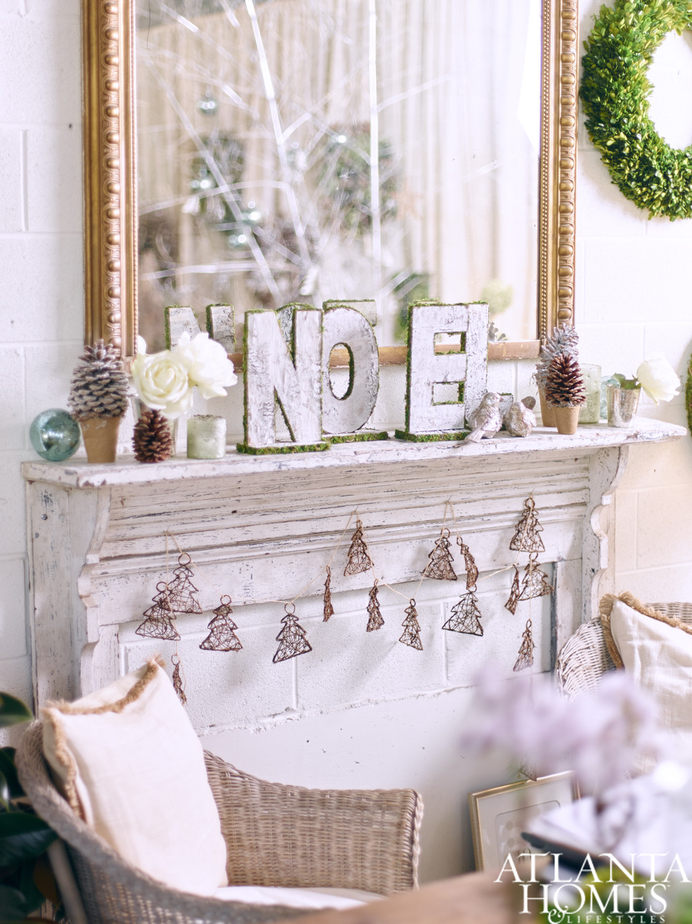 Shabby chic fireplace mantel decorated for Christmas with NOEL letters and mirror