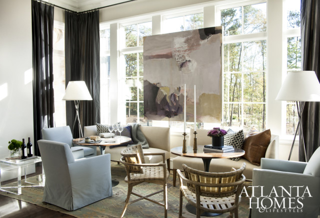 Floor-to-ceiling Classic Cloth draperies pay homage to the adjacent kitchen’s moodier hues.