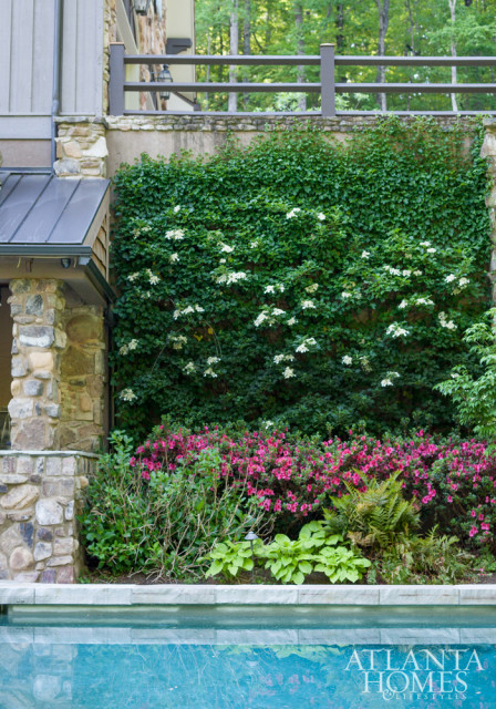 Nestled into the hillside and sited on three bountiful acres, this Sandy Springs abode is seamlessly connected to its nuanced interiors thanks to the design hand of Meridy King.