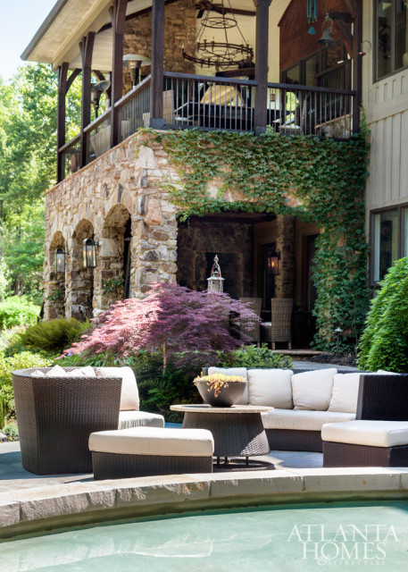 Two stories of covered terraces plus poolside seating accommodate overflow guests when the homeowners host parties.