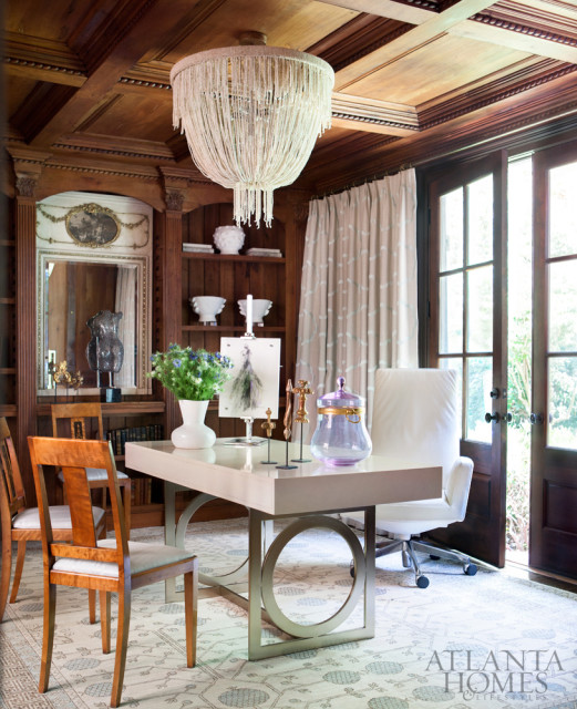 A beaded Carmen chandelier by Made Goods adds a whimsical touch to the feminine study.