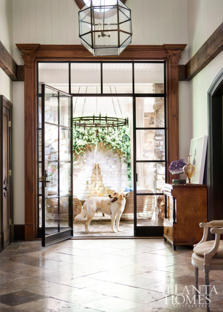 The outside and inside seamlessly intertwine thanks to large-scale, iron-trimmed doorways that lead to the front courtyard, where family dog Rambo is occasionally known to hold court.