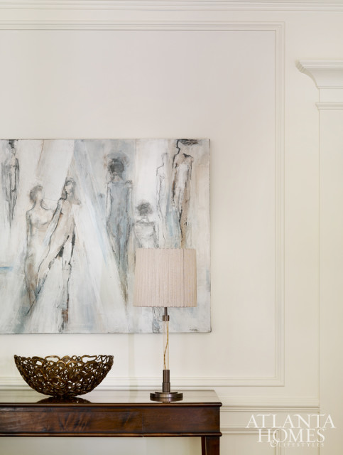 A Felicia Sharp painting from Pryor Fine Art Gallery hangs above the Holland & Company console.