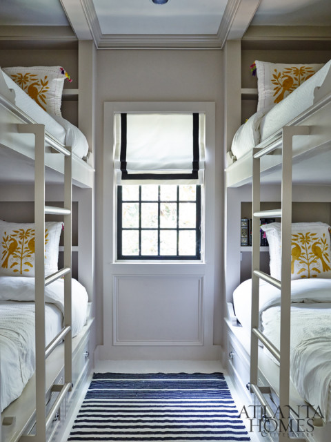 Dixon designed a compact bunk room that boasts a quad of sleeping spots complete with Otomi toss pillows.