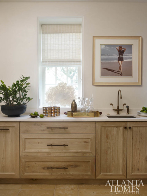 The home’s scullery kitchen doubles as a wet bar and keeps the main kitchen clutter-free.