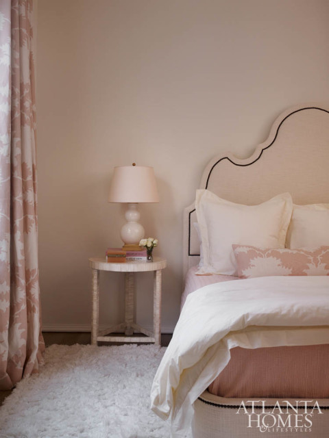 The all-pink bedroom was inspired by a floral Schumacher fabric.