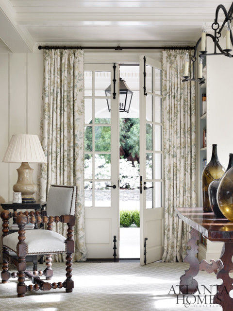 In the family room, French doors lead to the motor court.