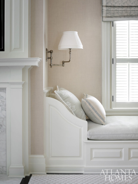 Upstairs in the master suite, a fireplace that projected into the room created an opportunity to design built-ins evoking récamiers on either side.