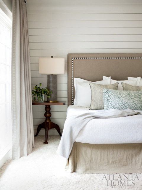 A beaded carpet by Atlanta Premier Upholstery and a soft, shag-like rug add neutral texture to the soothing master bedroom.