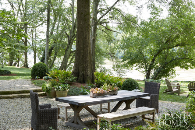 Furniture from RH and West Elm creates a casual dining area overlooking the Chattahoochee River.