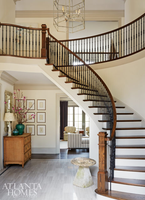 White oak marble was installed as a nod to formal entryways. It’s toned down with the lighter, narrow tiles. A Bonny Neiman chandelier adds contemporary drama to the inviting yet formal space.