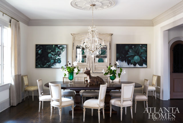 In the dining room, a pair of lime tree paintings by Joan Bonetti adds subtle drama to the otherwise tranquil room. The walls are China White with Revere Pewter trim, both by Benjamin Moore. An antique armoire from Interiors Market and a rock crystal chandelier from Pasadena Antique Center unify the space’s West Coast style and Southern sensibility impeccably curated by Meier.