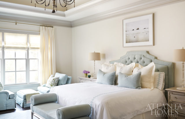 Celadon green is Karrie’s favorite color, so Amy filled the airy master bedroom with the hue via a headboard by AMD, Matouk bed linens and twin club chairs from Lee Industries.