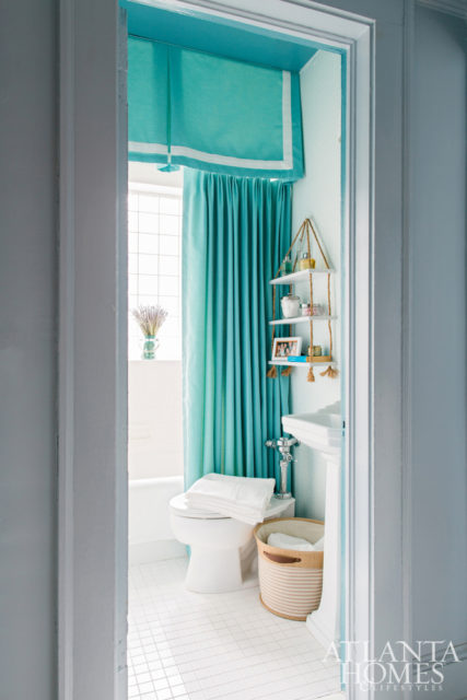 Aqua tones brighten up the home’s single bathroom.