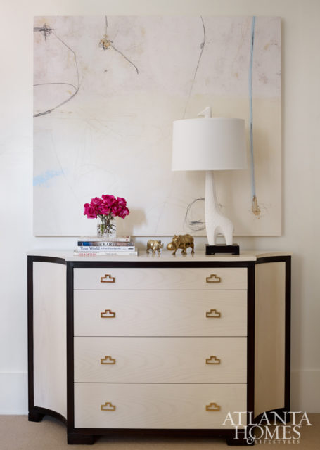 The chest of drawers is by Lillian August.